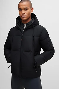 Equestrian hooded puffer jacket with fleece-lined pockets