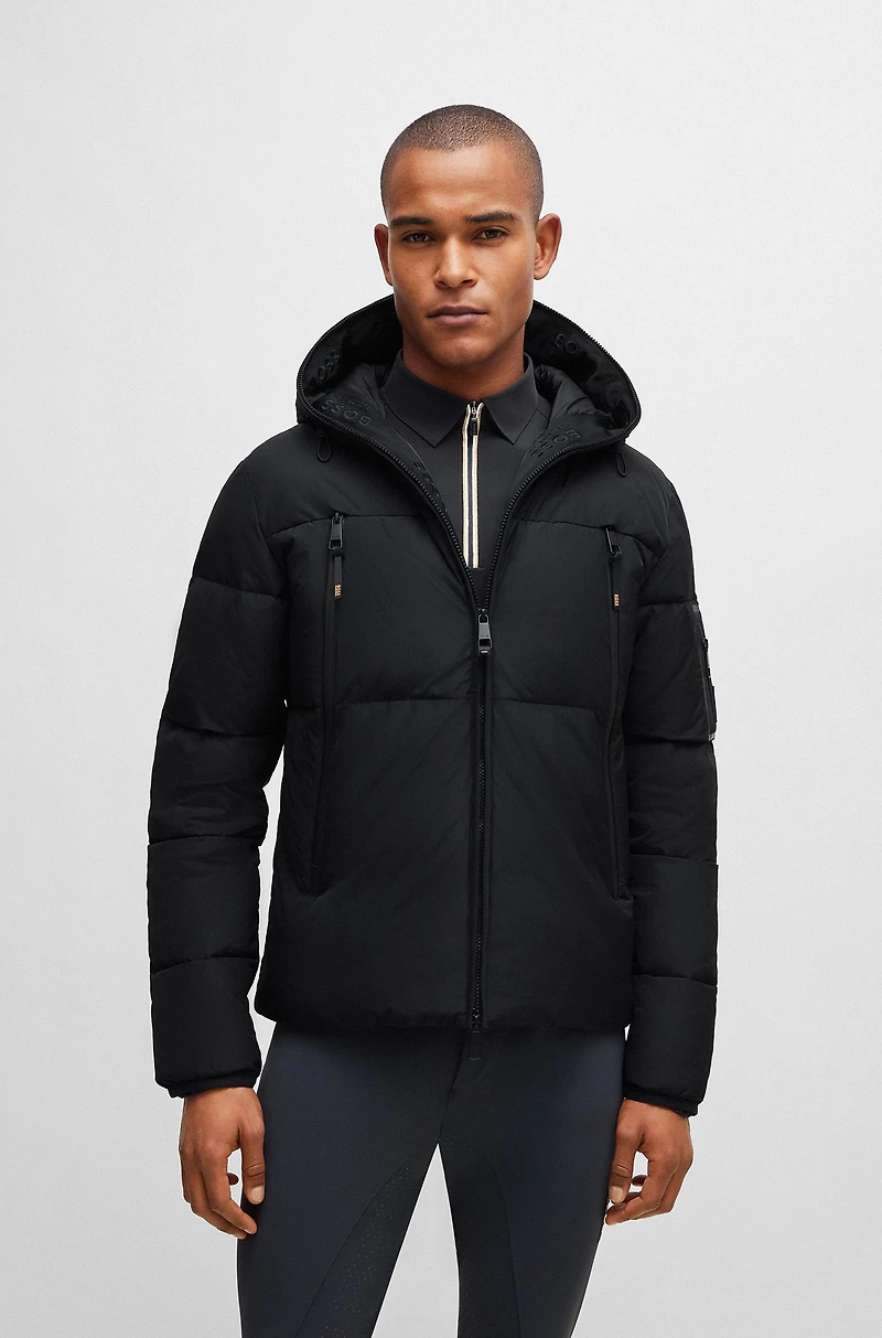 Equestrian hooded puffer jacket with fleece-lined pockets