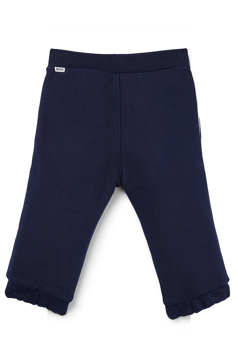 Kids' tracksuit bottoms with logo print
