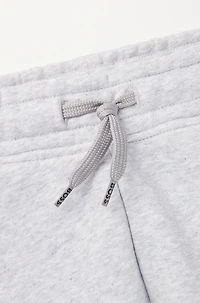 Kids' tracksuit bottoms with vertical logo print