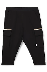 Kids' cargo trousers stretch piqué with logo label