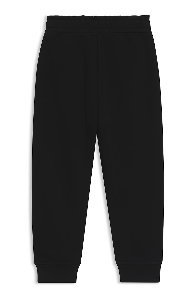 Kids' tracksuit bottoms with logo print