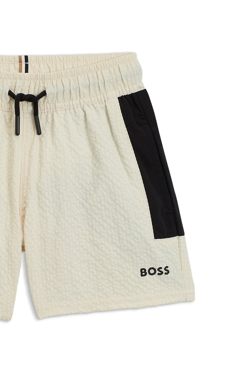 Kids' swim shorts seersucker fabric with logo print