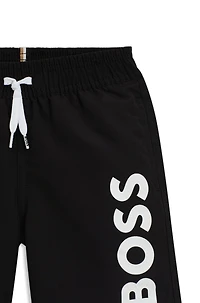 Kids' swim shorts peached fabric with logo print