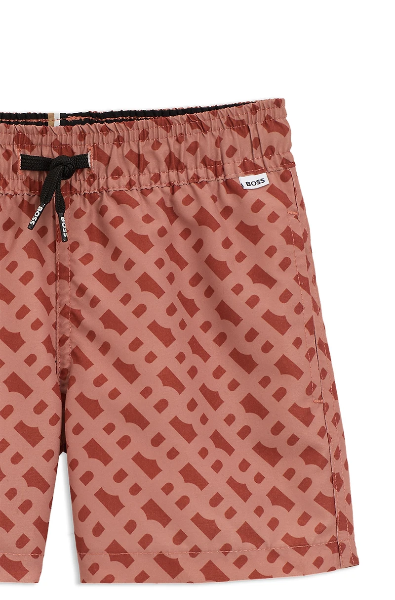 Kids' swim shorts with monogram print