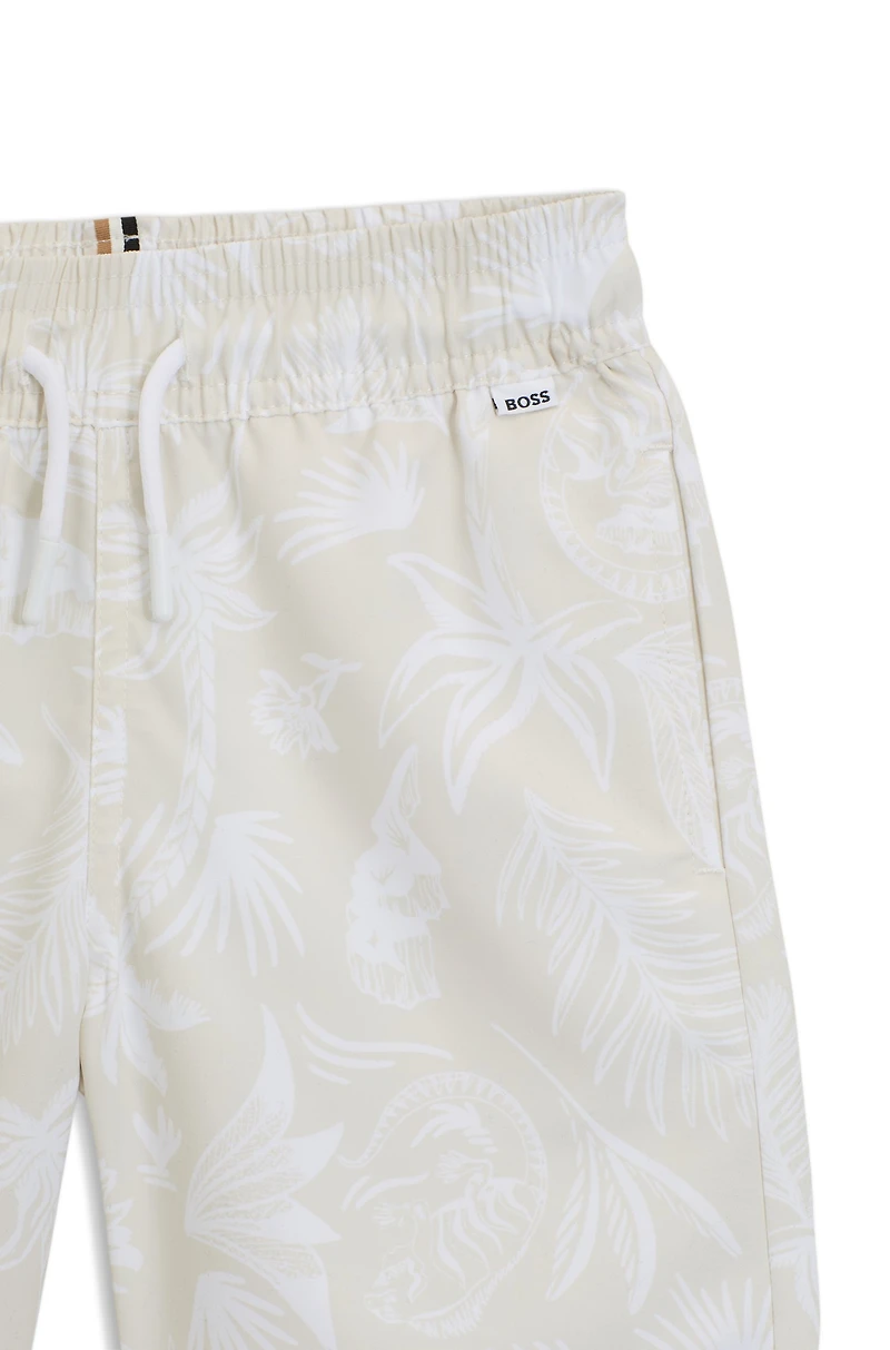 Kids' swim shorts with all-over palm-tree print