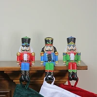 Sitting Nutcrackers Stocking Holders, Set of 3