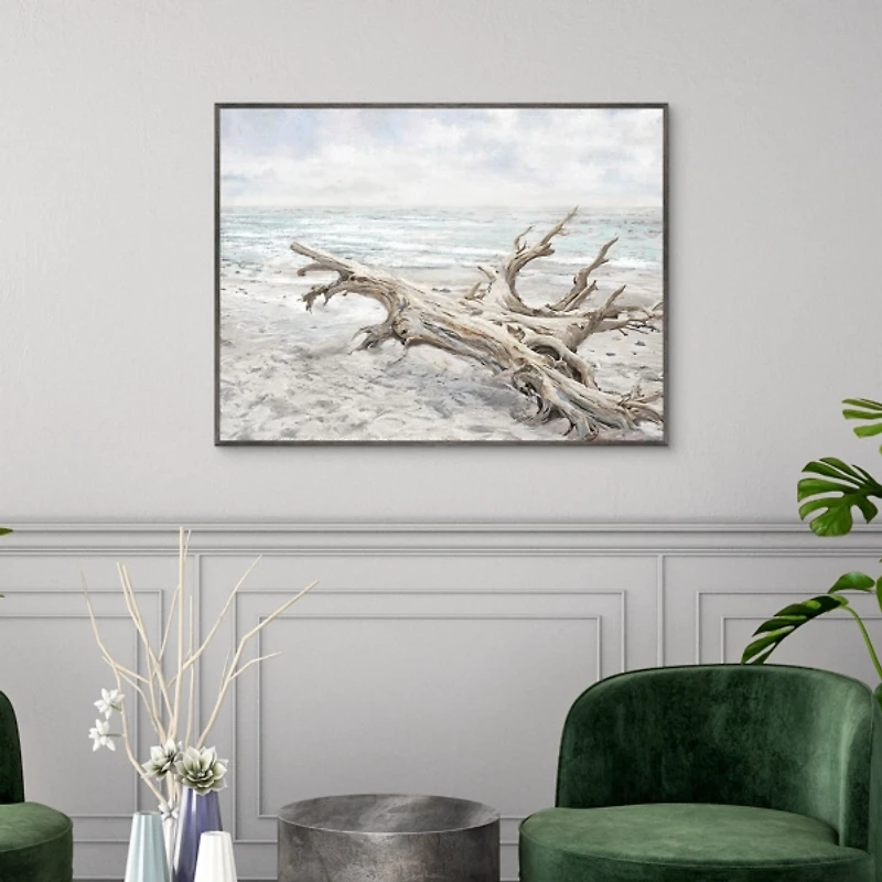 Driftwood On The Beach Framed Canvas Art Print