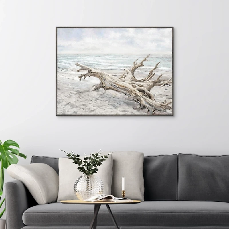 Driftwood On The Beach Framed Canvas Art Print