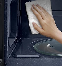 2.1 cu. ft. Over-the-Range Microwave with Edge to Edge Glass Display in Matte Black Steel | Samsung Canada
