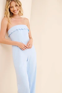 The Frolic Plum Scallop Jumpsuit