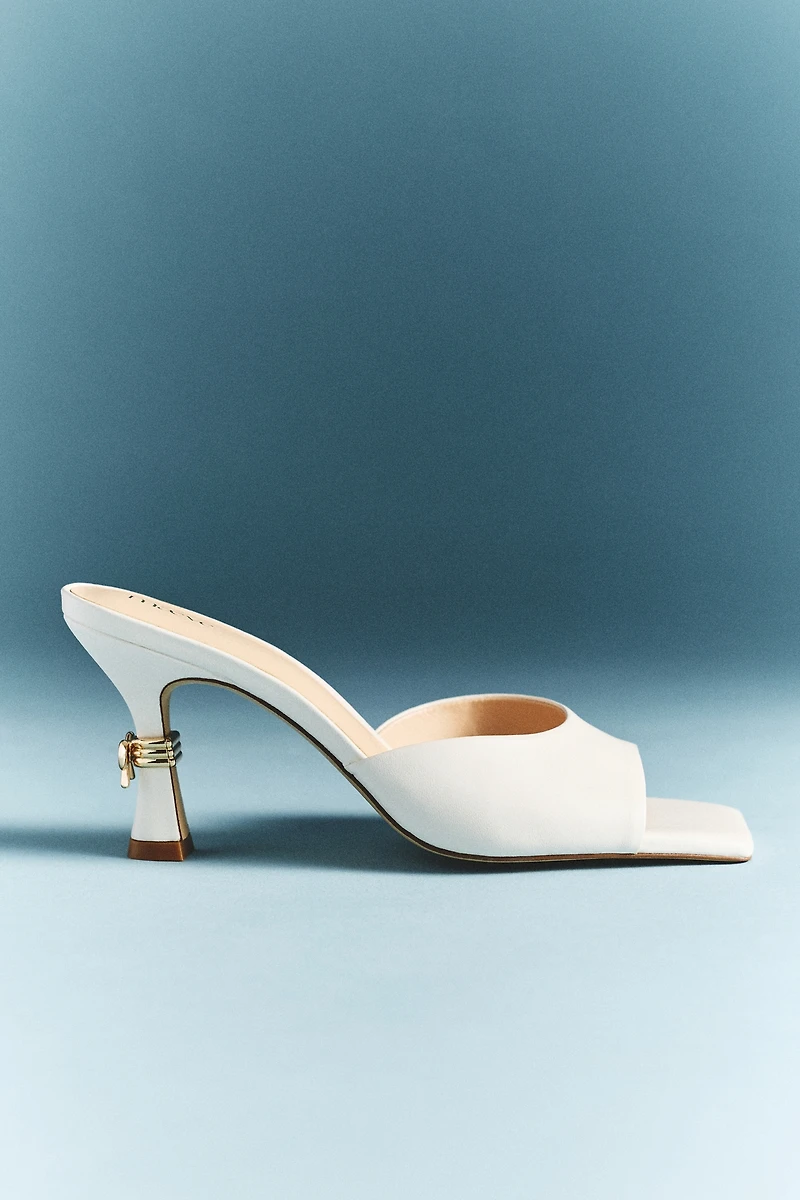 Maeve Metal Bow Open-Toe Mule Heels
