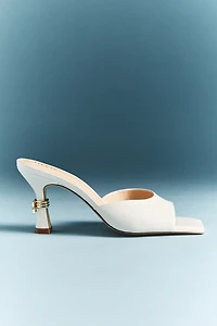 Maeve Metal Bow Open-Toe Mule Heels