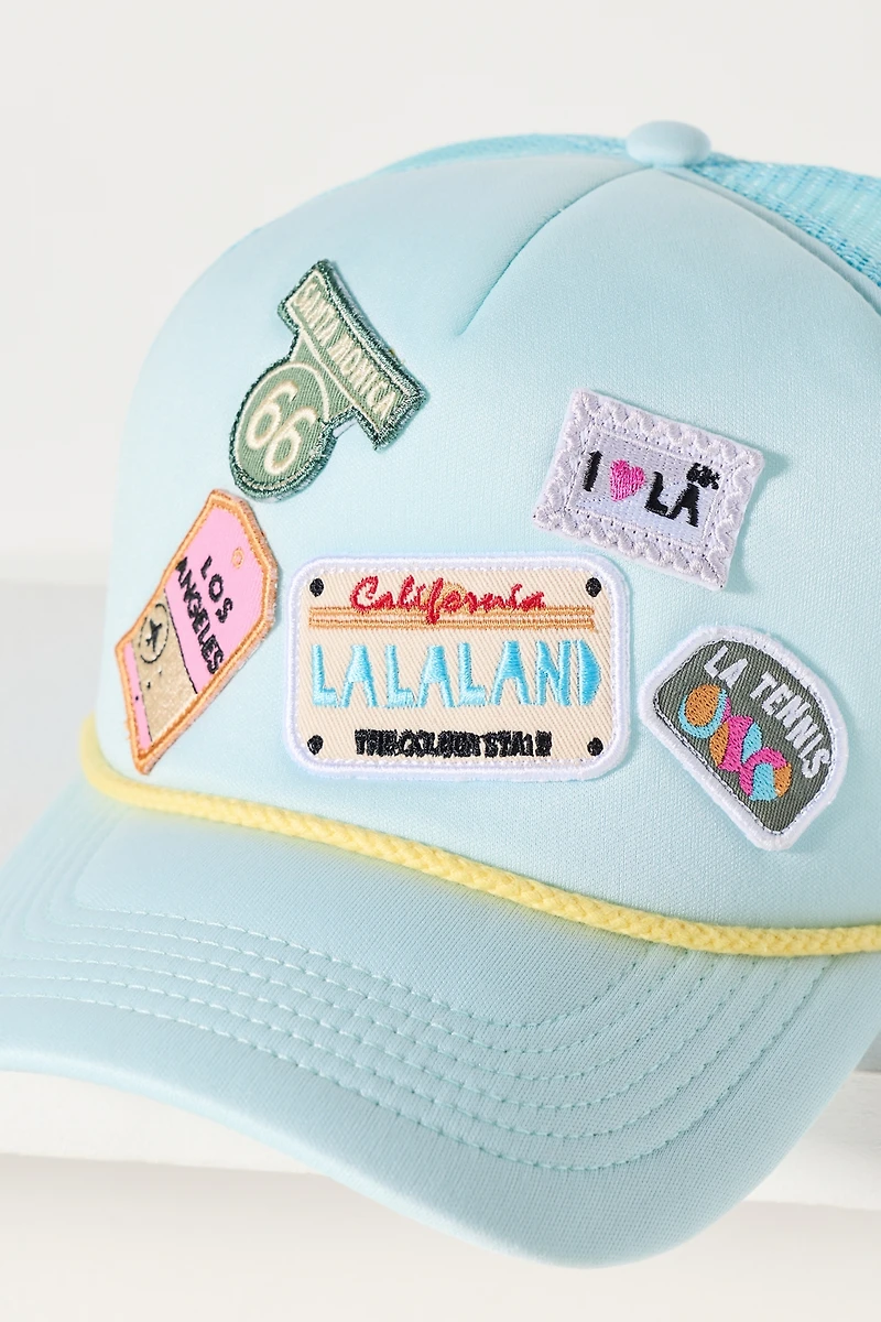 By Anthropologie Travel Trucker Hat