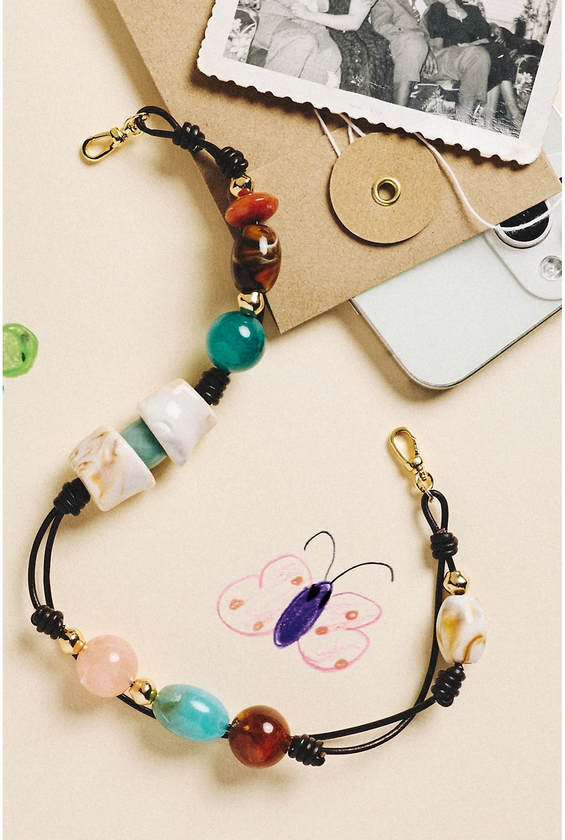 By Anthropologie Cord and Stone Beaded Phone Chain