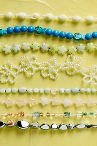 By Anthropologie Pearl Petals Phone Charm