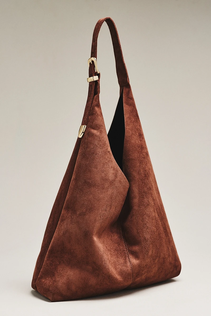 By Anthropologie Love Knot Faux Suede Buckle Slouchy Bag