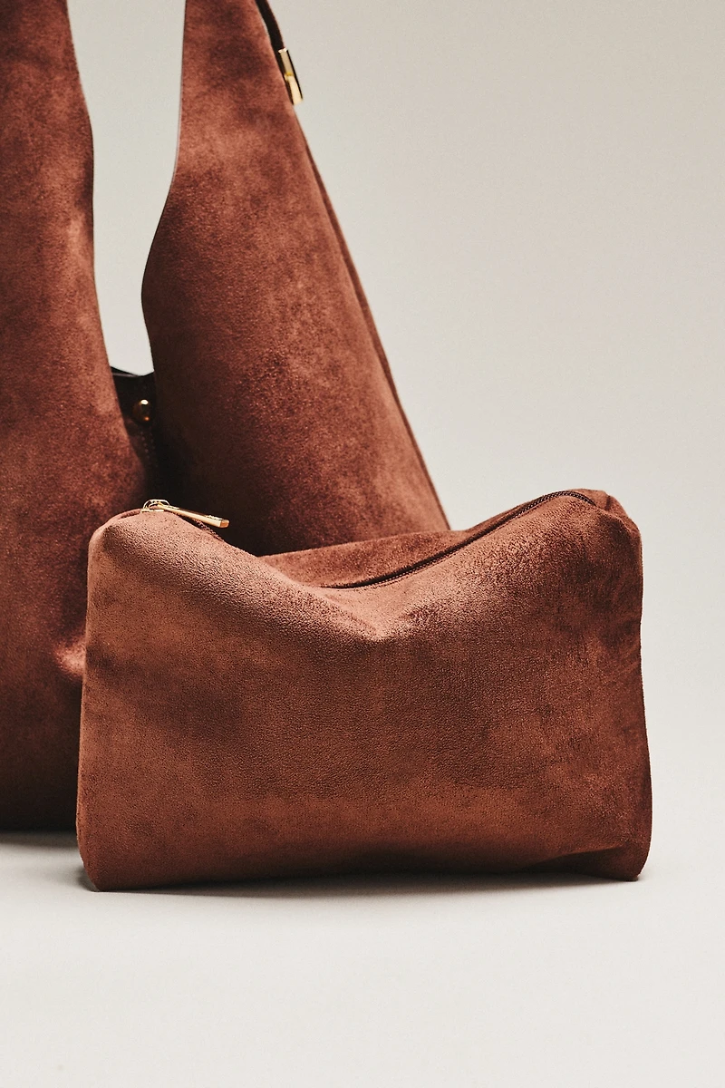 By Anthropologie Love Knot Faux Suede Buckle Slouchy Bag