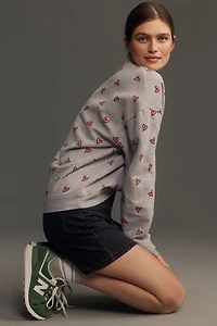 KULE The Oversized All Over Heart Sweatshirt