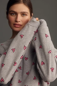 KULE The Oversized All Over Heart Sweatshirt