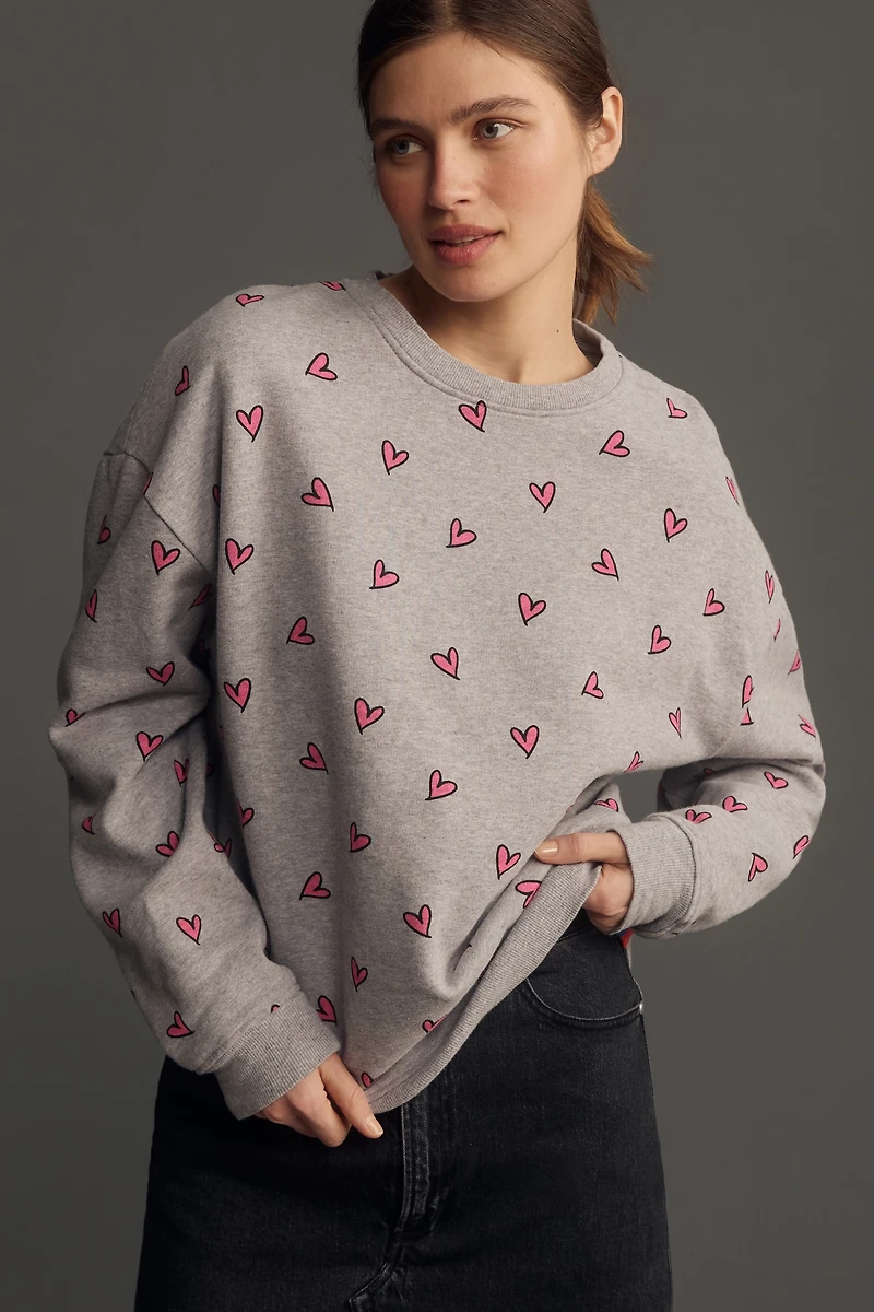 KULE The Oversized All Over Heart Sweatshirt
