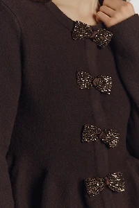 Endless Rose Bow Peplum Sweater