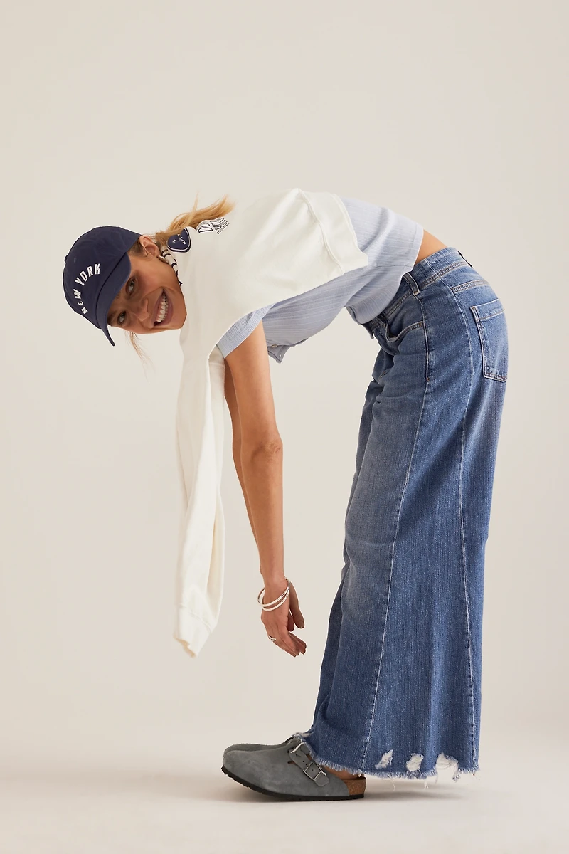 The Adi Regenerative Cotton Mid-Rise Flare Jeans by Pilcro