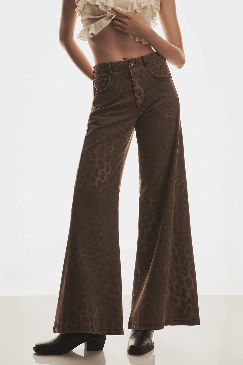 The Adi Leopard Mid-Rise Flare Jeans by Pilcro