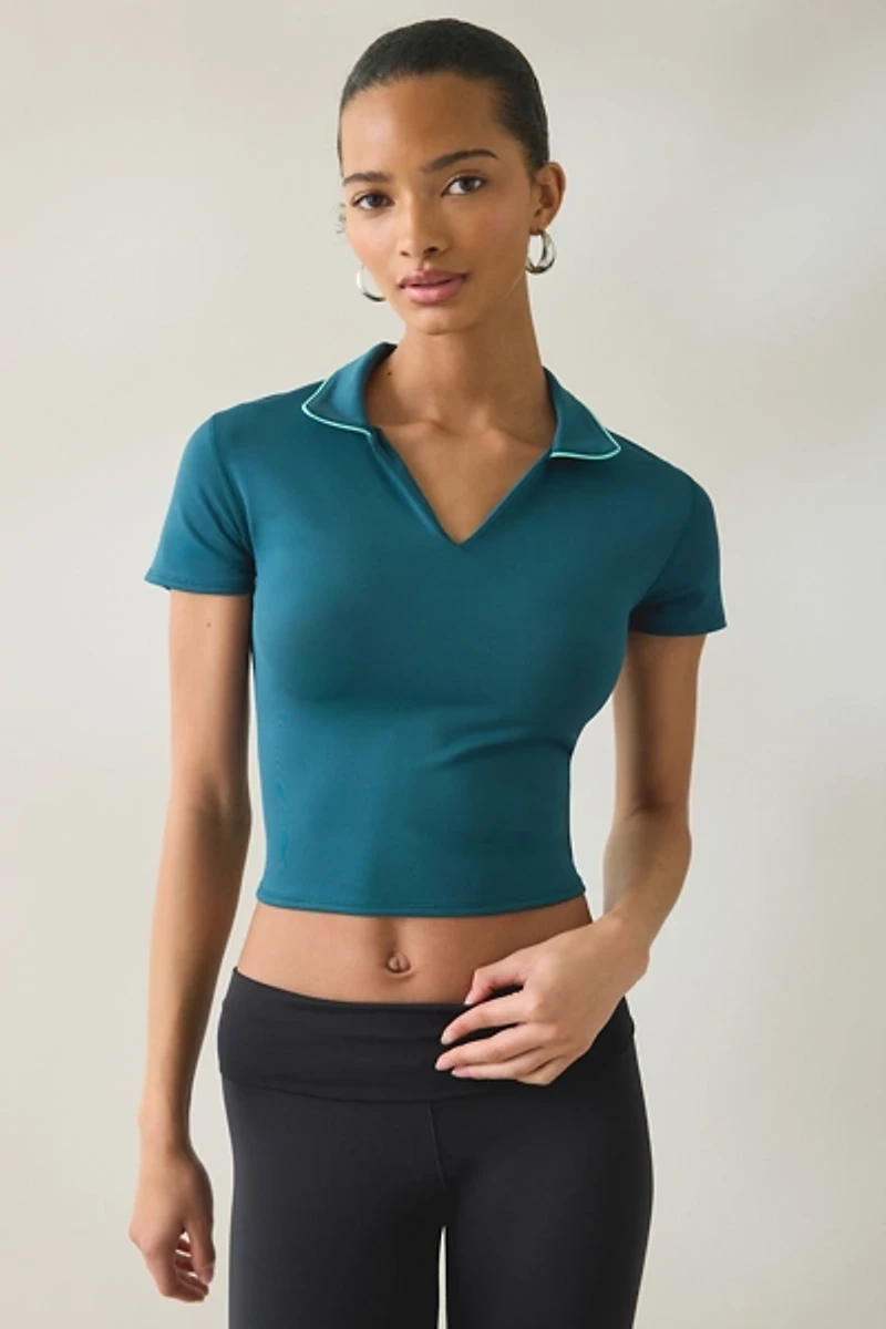 New Balance Tournament Cropped Short Sleeve Polo