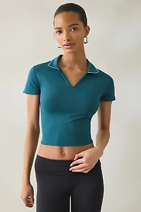 New Balance Tournament Cropped Short Sleeve Polo