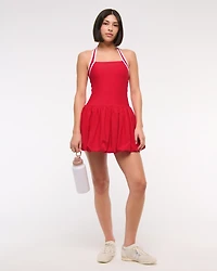 YPB motionTEK Halter Bubble Hem Mini Dress
