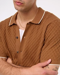 Polo estilo suéter abotonado con pespuntes de diamantes