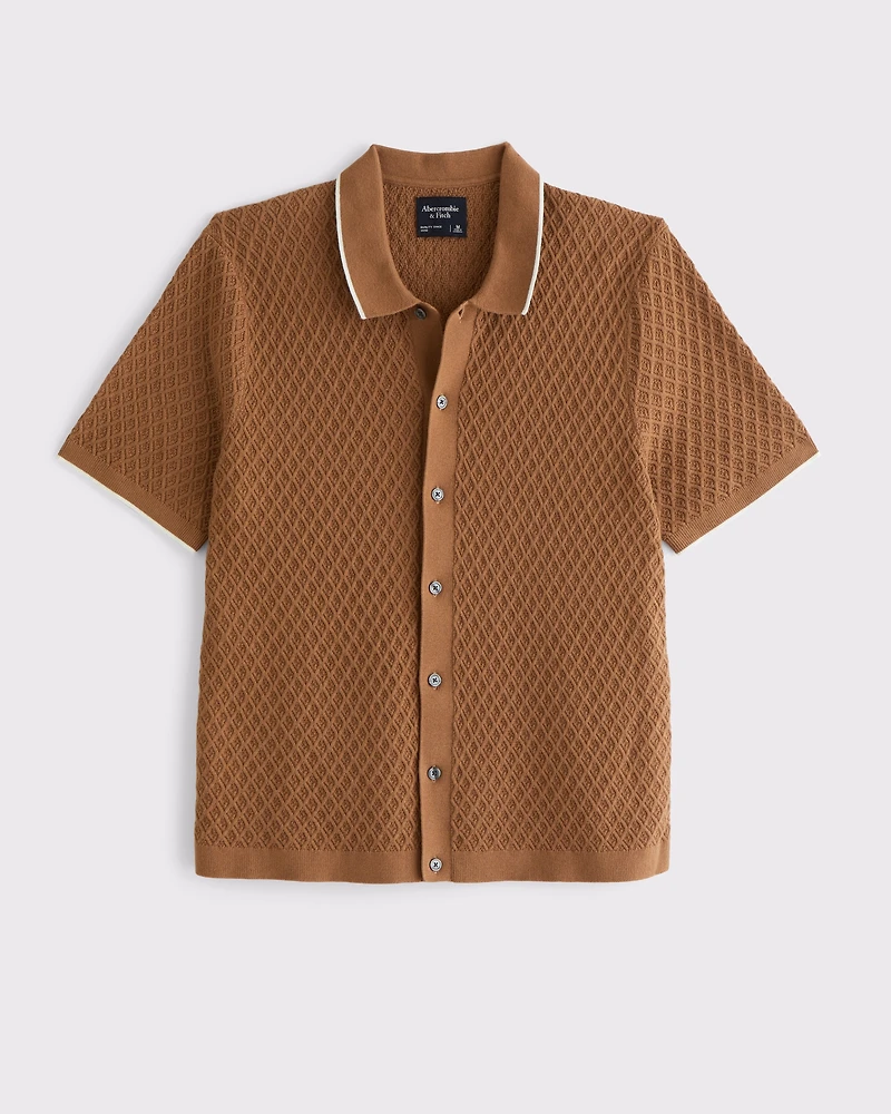 Polo estilo suéter abotonado con pespuntes de diamantes