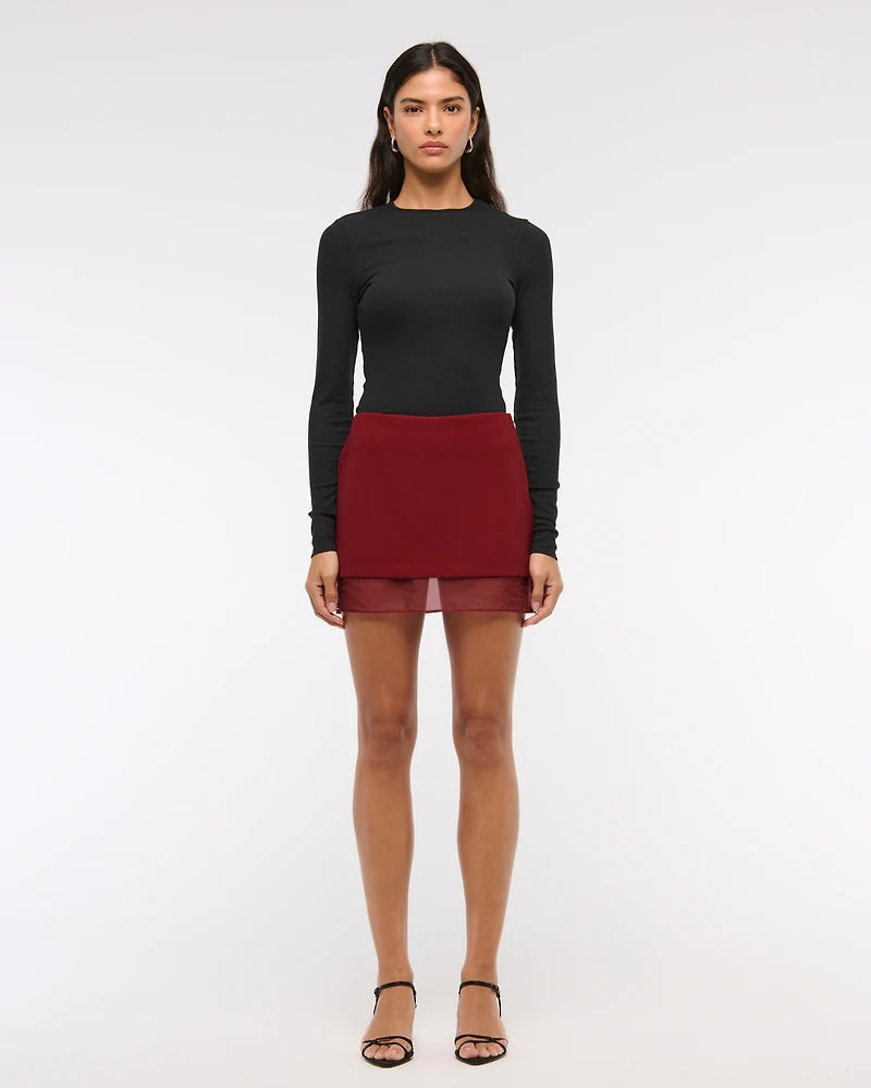Mid Rise Sheer Hem Mini Skort