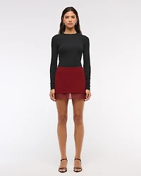 Mid Rise Sheer Hem Mini Skort