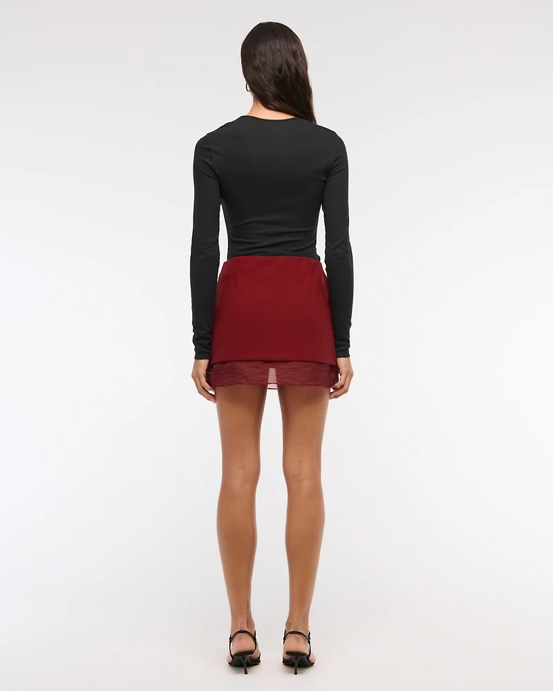 Mid Rise Sheer Hem Mini Skort