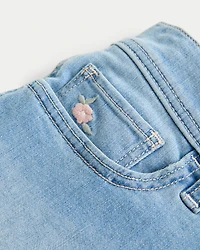 Low-Rise Light Wash Floral Embroidered Denim Shortie Shorts
