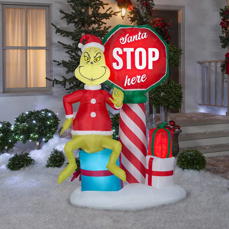 6ft. Airblown® Inflatable Grinch with Santa Stop Here Sign