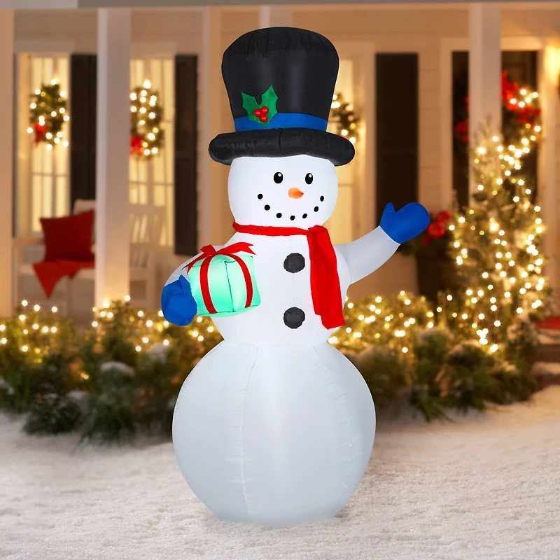 7ft. Airblown® Inflatable Snowman with Gift