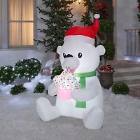 5.5ft. Animated Airblown® Inflatable Nom Nom Polar Bear with Cupcake
