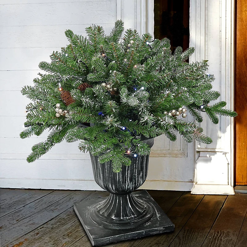 24" Feel Real® Snowy Morgan Spruce Porch Bush in Silver Brushed Plastic Urn with Cones & Champagne Berries