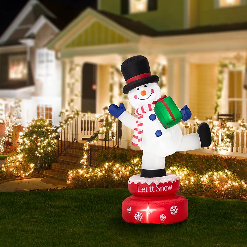 Glitzhome® 6ft. Lighted Inflatable Rotating Snowman Décor