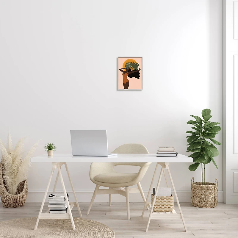 Stupell Industries Female Holding Tropical Monstera Leaf under Sun in Frame Wall Art