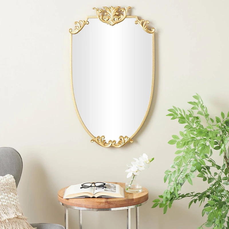 21" x 34" Gold Metal Shield Wall Mirror with Floral Embellishment