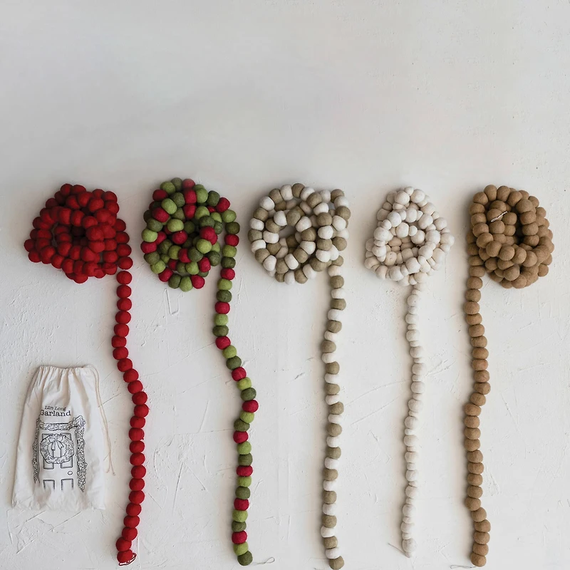 Hello Honey® 12ft. Handmade Wool Felt Ball Garland in Printed Drawstring Bag