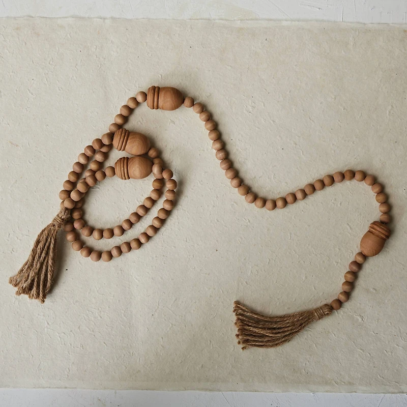 Hello Honey® 6ft. Wood Beads & Acorns with Jute Tassels Garland