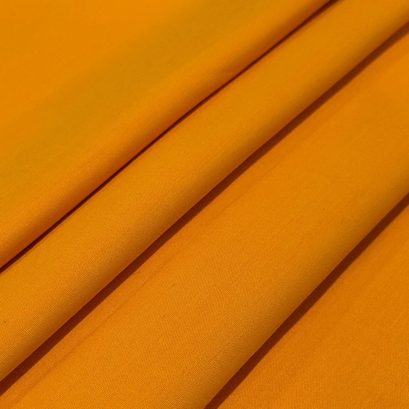 Feldman Solid Light Orange Quilting Broadcloth Fabric