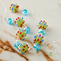 12 Packs: 6 ct. (72 total) Green Lampwork Glass Bumpy Round Beads by Bead Landing™