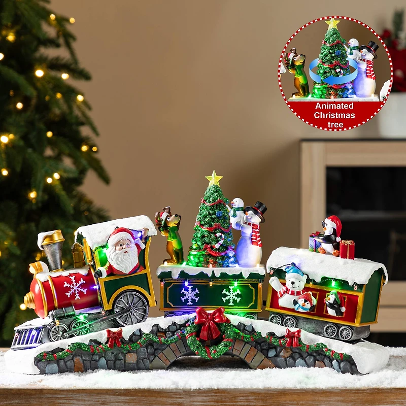 Glitzhome® 20" Lighted Christmas Santa Train Resin Village with Movement and Music