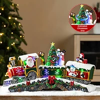 Glitzhome® 20" Lighted Christmas Santa Train Resin Village with Movement and Music